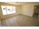 Bright and spacious living room with hardwood floors and large windows at 2018 N 52Nd Dr, Phoenix, AZ 85035