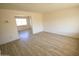 Bright and spacious living room with hardwood floors and large windows at 2018 N 52Nd Dr, Phoenix, AZ 85035