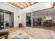 Covered patio with stone tile flooring and views into the home's interior at 17197 W Thousand Oaks St, Surprise, AZ 85388