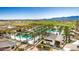 Aerial view of community pools, clubhouse, and surrounding landscape at 17197 W Thousand Oaks St, Surprise, AZ 85388