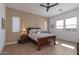 Bright bedroom with wood bed frame and side tables at 17197 W Thousand Oaks St, Surprise, AZ 85388
