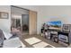 Home office with sliding barn door and access to a private patio at 17197 W Thousand Oaks St, Surprise, AZ 85388