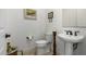 Clean powder room with pedestal sink and toilet at 17197 W Thousand Oaks St, Surprise, AZ 85388