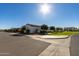 Single-story home with landscaped yard, driveway, and attractive exterior at 17197 W Thousand Oaks St, Surprise, AZ 85388