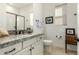 Bathroom with granite countertop, white cabinets, and a walk-in shower at 17197 W Thousand Oaks St, Surprise, AZ 85388