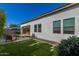 Artificial turf backyard with a view of the pool and home exterior at 17197 W Thousand Oaks St, Surprise, AZ 85388