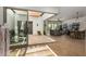 Open concept living and dining area with sliding glass doors to a courtyard at 17197 W Thousand Oaks St, Surprise, AZ 85388