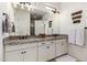 Bathroom with double vanity and granite countertop at 17197 W Thousand Oaks St, Surprise, AZ 85388