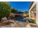 Enjoy this refreshing pool with patio furniture and a tranquil ambiance at 17197 W Thousand Oaks St, Surprise, AZ 85388