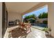 Covered patio with outdoor dining area and view of a private pool at 17197 W Thousand Oaks St, Surprise, AZ 85388