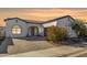 Front view of a beautiful home with landscaping at 17197 W Thousand Oaks St, Surprise, AZ 85388