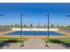 A well-lit pickleball court in a community setting at 17197 W Thousand Oaks St, Surprise, AZ 85388