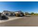 Single-story home with a brick and stucco exterior, and a welcoming front porch at 17197 W Thousand Oaks St, Surprise, AZ 85388