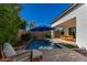 Enjoy the inviting pool, patio seating and the surrounding landscape at 17197 W Thousand Oaks St, Surprise, AZ 85388