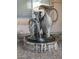Ornate stone fountain with cascading water feature at 2541 E Carob Dr, Gilbert, AZ 85298