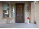 Inviting front entry with decorative door and accents at 2541 E Carob Dr, Gilbert, AZ 85298
