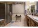 Spa-like bathroom featuring a shower, double vanity, and tile floors at 2541 E Carob Dr, Gilbert, AZ 85298