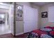 Bedroom with wood floors and sliding closet doors at 2541 E Carob Dr, Gilbert, AZ 85298