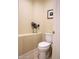 Clean and simple half bathroom with a single toilet at 2541 E Carob Dr, Gilbert, AZ 85298