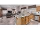 Modern kitchen with granite island and stainless steel appliances at 21064 N 72Nd Pl, Scottsdale, AZ 85255