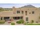 Back exterior view of home with patio and mountain views at 9701 E Happy Valley Rd # 16, Scottsdale, AZ 85255