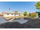 Spacious backyard with a large grassy area and shed at 809 W Lindner Ave, Mesa, AZ 85210