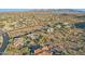 Aerial view of a luxury home with a pool, situated in a mountain community at 11255 S San Adrian Ln, Goodyear, AZ 85338