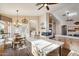 Open concept kitchen with an island, breakfast nook, and a view of the living room at 11255 S San Adrian Ln, Goodyear, AZ 85338