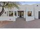 Elegant stucco home with a dark wood door at 29808 N 63Rd St, Cave Creek, AZ 85331