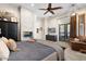 Main bedroom with fireplace and sliding glass doors to backyard at 4243 E Ashler Hills Dr, Cave Creek, AZ 85331