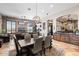 Open dining area with large windows and a rustic wooden table at 4243 E Ashler Hills Dr, Cave Creek, AZ 85331