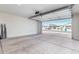 Attached garage with open door, offering view of neighborhood at 36063 W San Alvarez Ave, Maricopa, AZ 85138