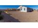 Spacious backyard with gravel and a block wall at 36063 W San Alvarez Ave, Maricopa, AZ 85138