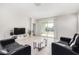 Spacious living room with sliding glass doors leading to backyard at 36063 W San Alvarez Ave, Maricopa, AZ 85138