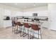 Modern kitchen with granite countertops and breakfast bar at 36063 W San Alvarez Ave, Maricopa, AZ 85138