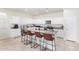Modern kitchen with granite countertops and breakfast bar at 36063 W San Alvarez Ave, Maricopa, AZ 85138