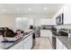 Kitchen with granite countertops, stainless steel appliances, and island at 36063 W San Alvarez Ave, Maricopa, AZ 85138