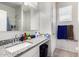 Clean bathroom with granite countertop, single sink, and shower/tub combo at 36063 W San Alvarez Ave, Maricopa, AZ 85138