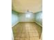 Large bedroom with tile floors and a ceiling fan at 5522 E Colby St, Mesa, AZ 85205