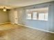 Living room featuring tile flooring, a ceiling fan, and a window view at 5522 E Colby St, Mesa, AZ 85205