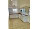 Kitchen with light-grey cabinets and tile flooring at 5522 E Colby St, Mesa, AZ 85205