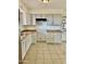 Kitchen with white cabinets, tile floors, and built-in appliances at 5522 E Colby St, Mesa, AZ 85205