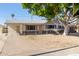 Charming single story house with mature tree and gravel driveway at 11620 N 32Nd Dr, Phoenix, AZ 85029