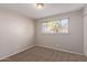 Well-lit bedroom with carpet and window coverings at 11620 N 32Nd Dr, Phoenix, AZ 85029