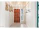 Bright entryway with tile flooring and wood front door at 11544 W Javelina Ct, Surprise, AZ 85378