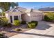 Single-story home with a two-car garage and well-maintained landscaping at 11544 W Javelina Ct, Surprise, AZ 85378