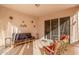 Outdoor patio with seating and sliding glass door access at 11544 W Javelina Ct, Surprise, AZ 85378