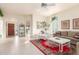 Bright and airy living room with a fireplace and tiled floor at 11544 W Javelina Ct, Surprise, AZ 85378