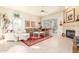 Spacious living room with a fireplace and lots of natural light at 11544 W Javelina Ct, Surprise, AZ 85378