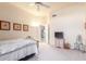 Bedroom with a queen bed and access to another room at 11544 W Javelina Ct, Surprise, AZ 85378